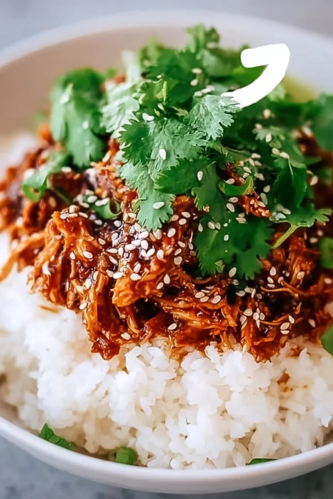 Slow cooker honey garlic chicken served with vegetables on a plate