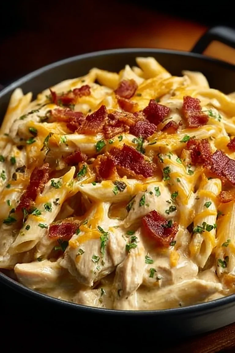 Creamy Crack Chicken Penne dish served in a bowl with garnishments