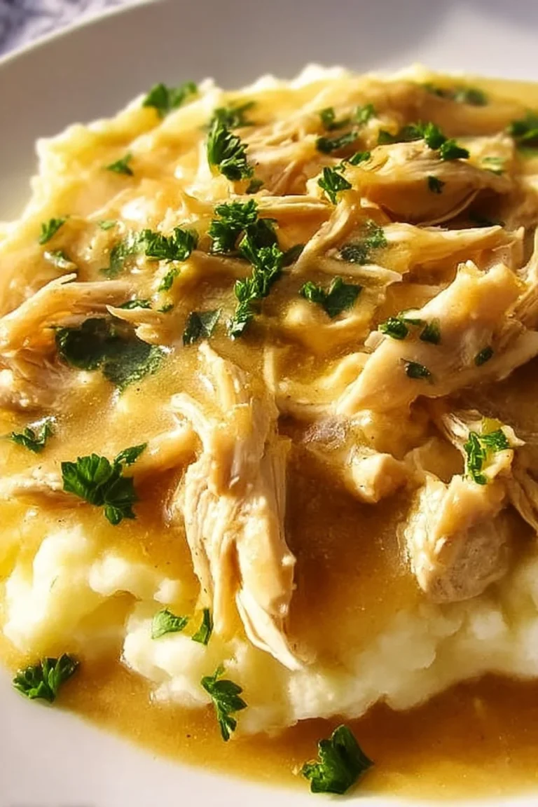 Delicious Slow Cooker Chicken and Gravy served with mashed potatoes