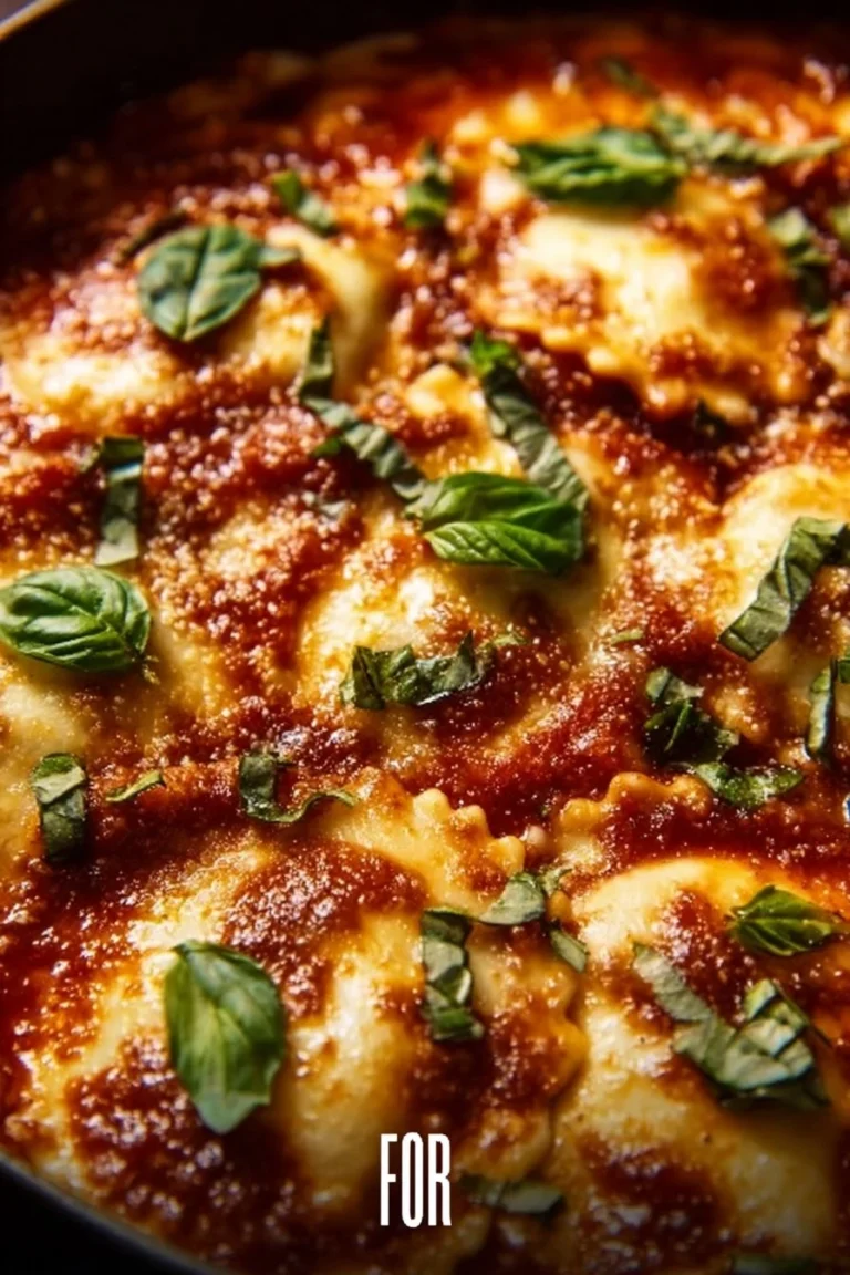 Baked ravioli served with marinara sauce and melted cheese
